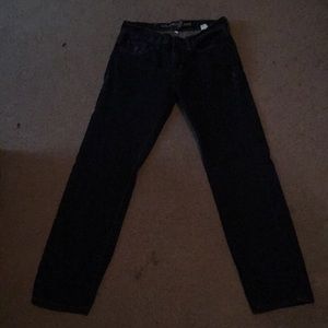 Men’s dark wash jeans.